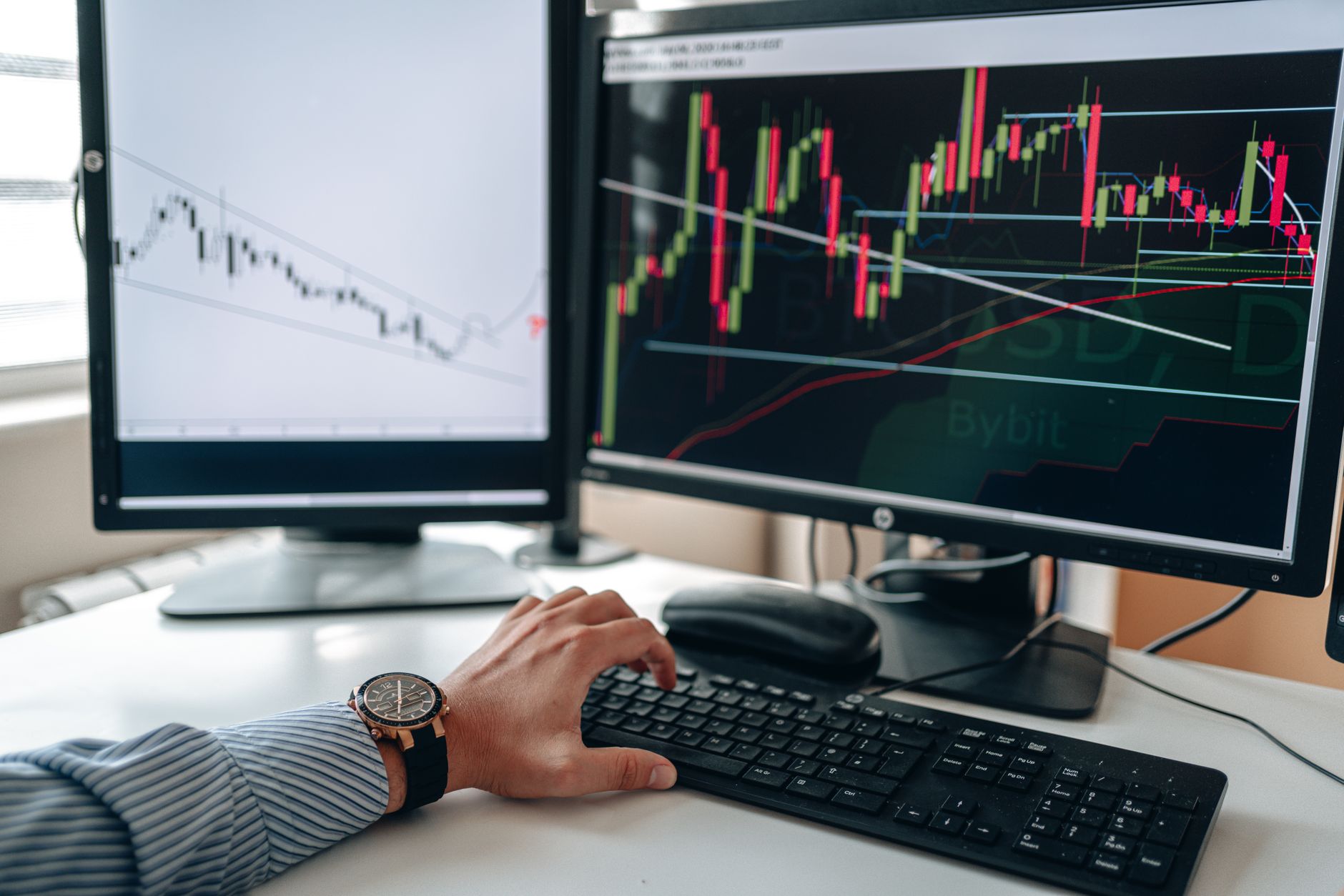 Dual monitor workspace managing dual host agency booking portals simultaneously
